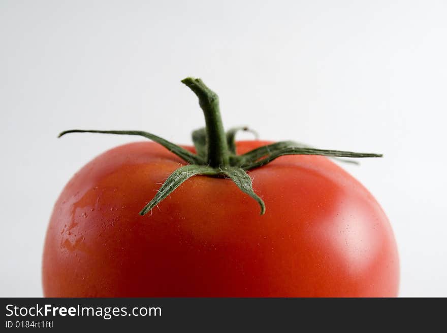 Red ripe tomato on a white background