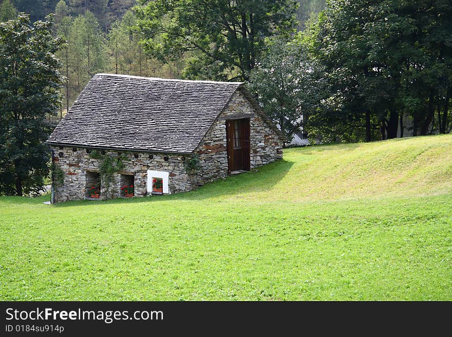 Mountain stone house in the Swiss Alps