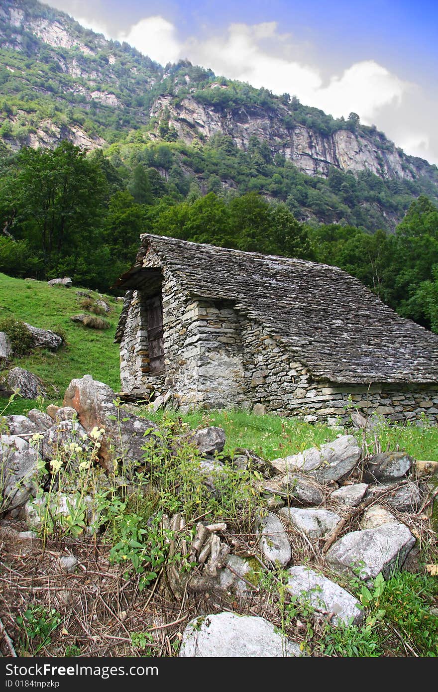 Mountain stone house in the Swiss Alps