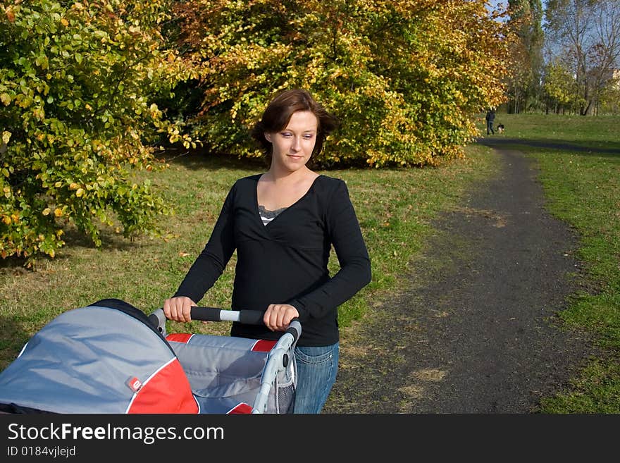 Woman with baby in park. Woman with baby in park