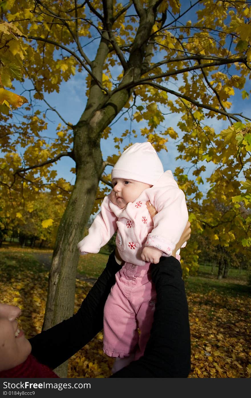 Happy woman with baby outdoor