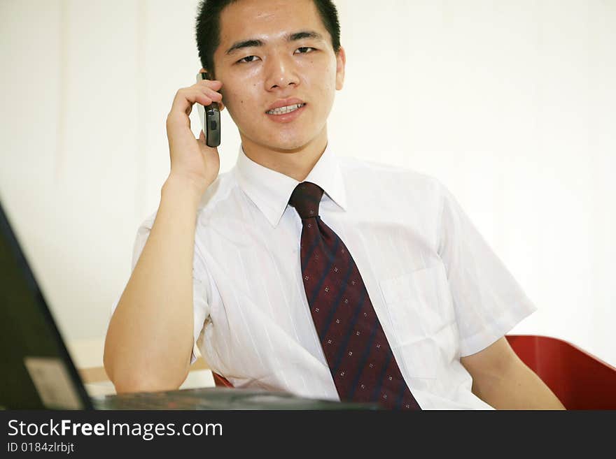 Young asian businessman in office