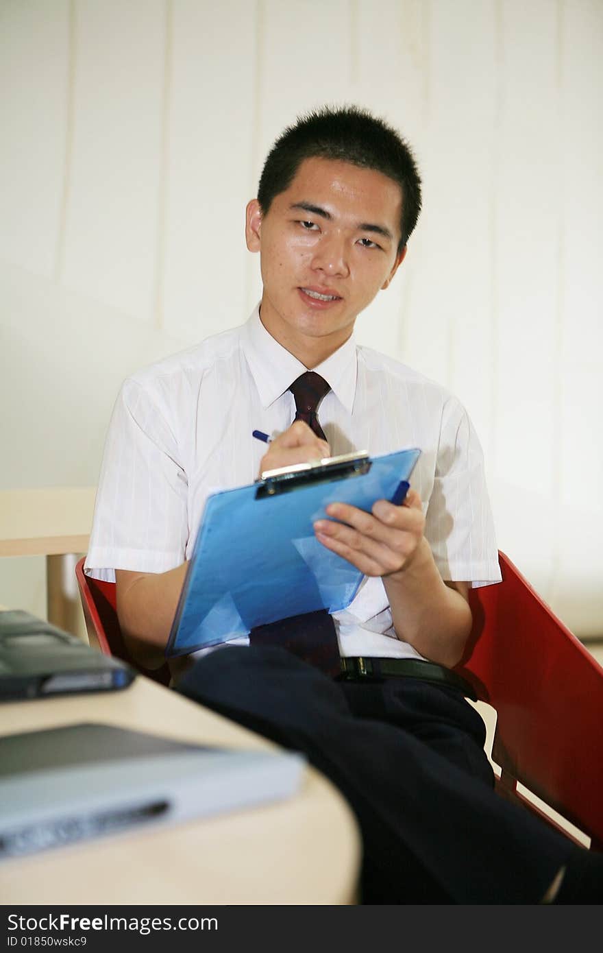 Young asian businessman in office