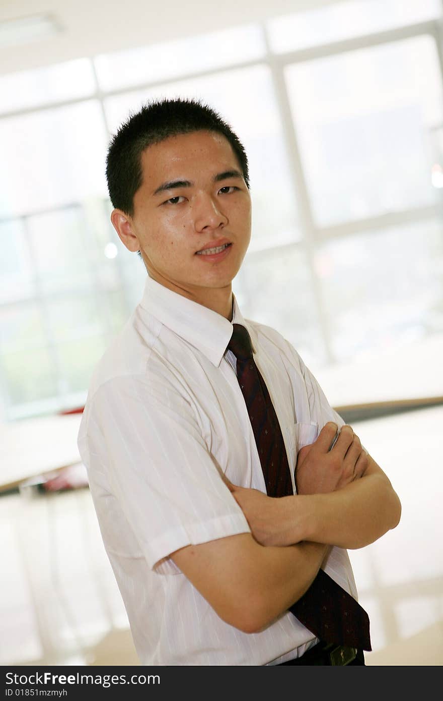 Young asian business man in office. Young asian business man in office