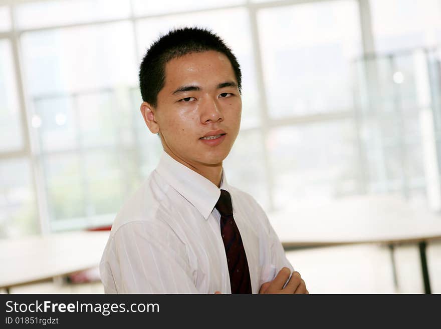 Young asian business man in office. Young asian business man in office