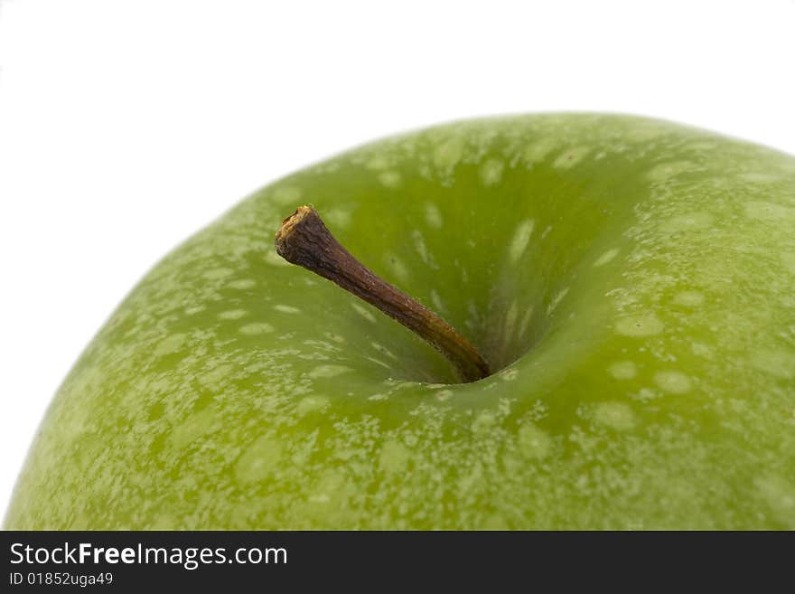 Detail of a granny smith  apple isolated on white background