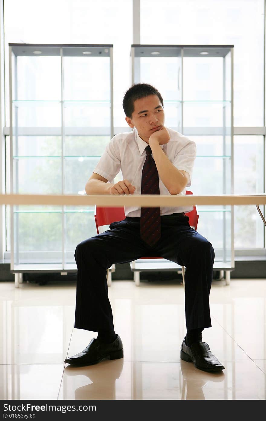 Young asian businessman sit in office. Young asian businessman sit in office