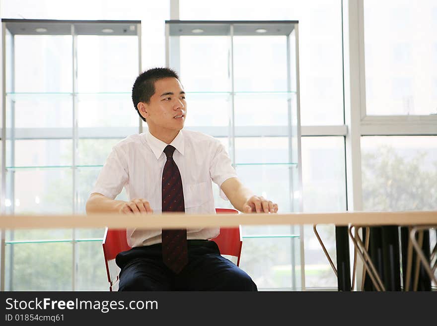 Young asian businessman sit in office. Young asian businessman sit in office