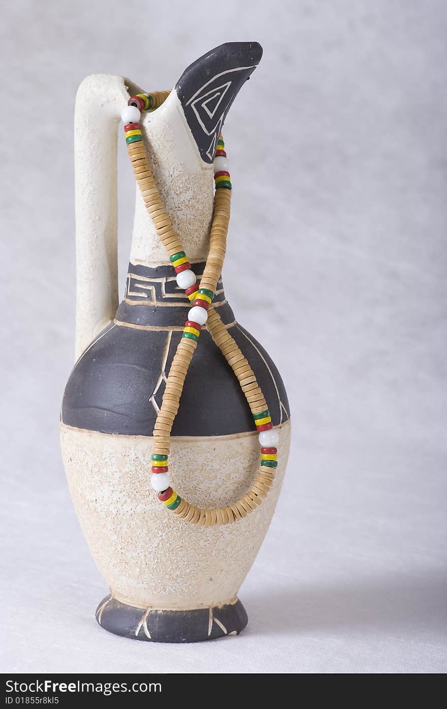 Clay jug and beads