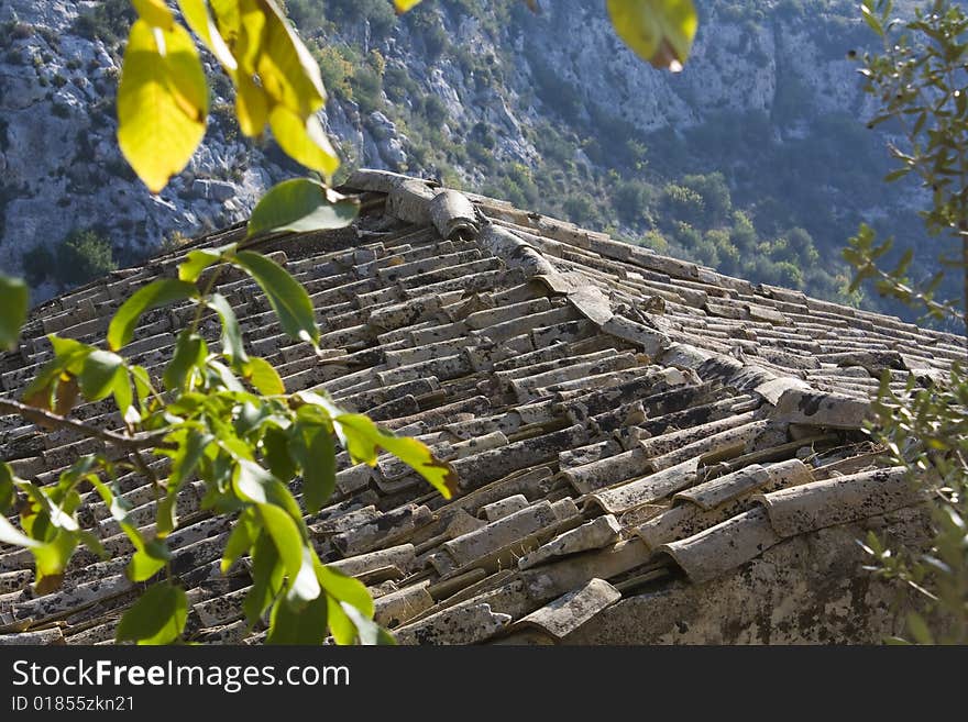 Ancient roof tiles of an old mountain home. Ancient roof tiles of an old mountain home