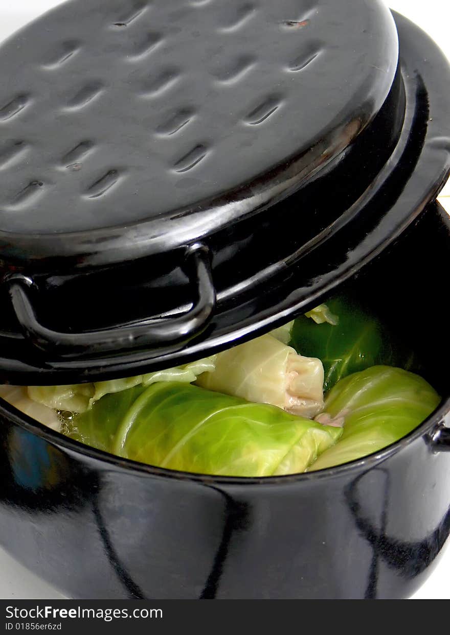 Close up of the tasty stuffed cabbage in black baking tin.