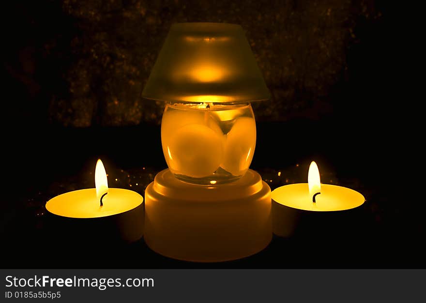 Group of candles against a dark background