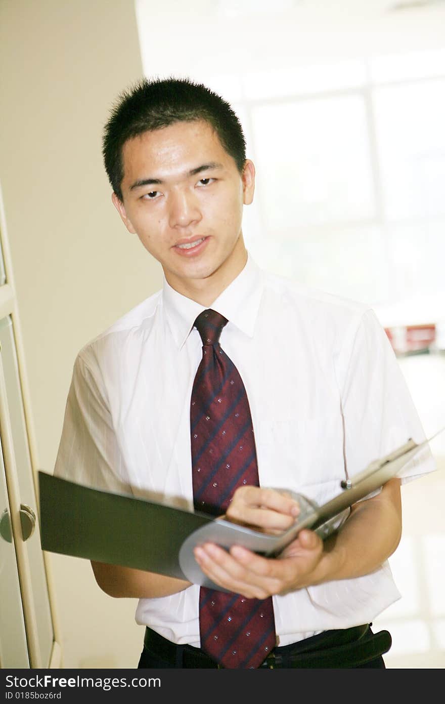 A young asian working in office