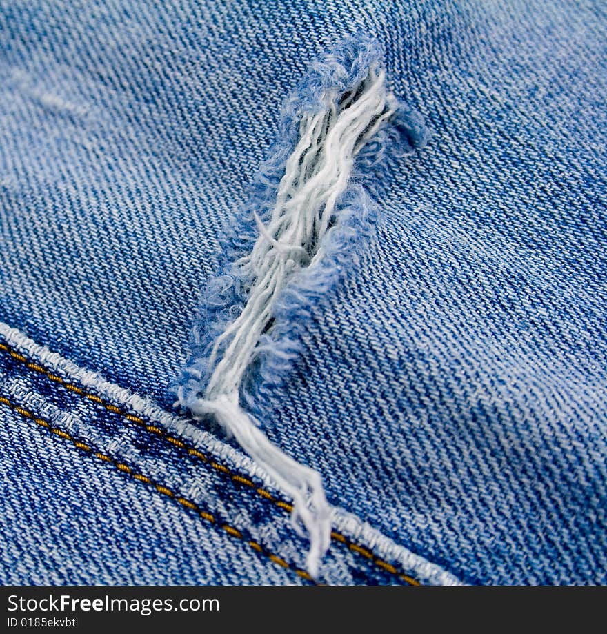 Old blue jeans close up. Old blue jeans close up