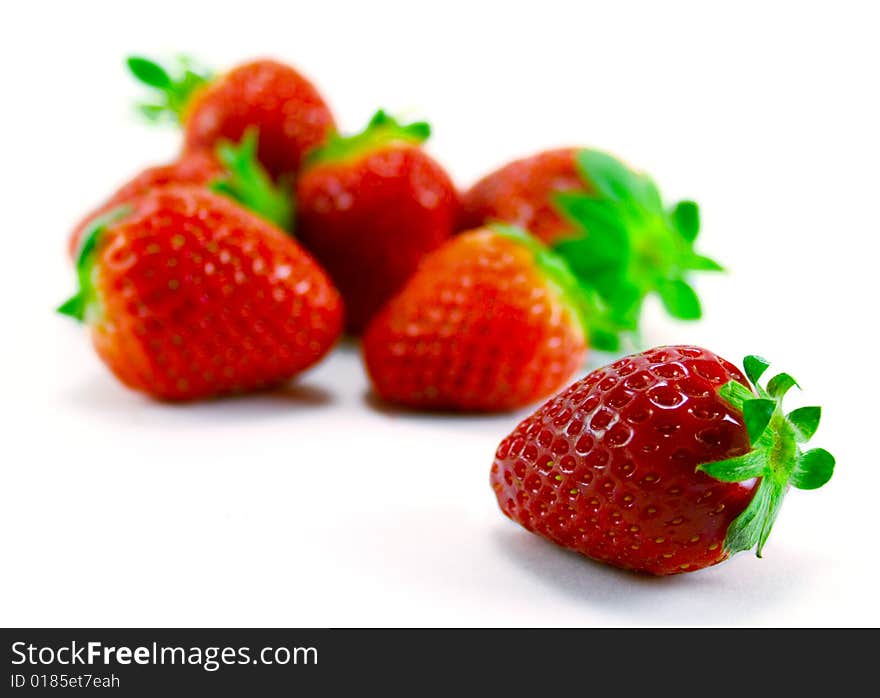 Heap of strawberries on white