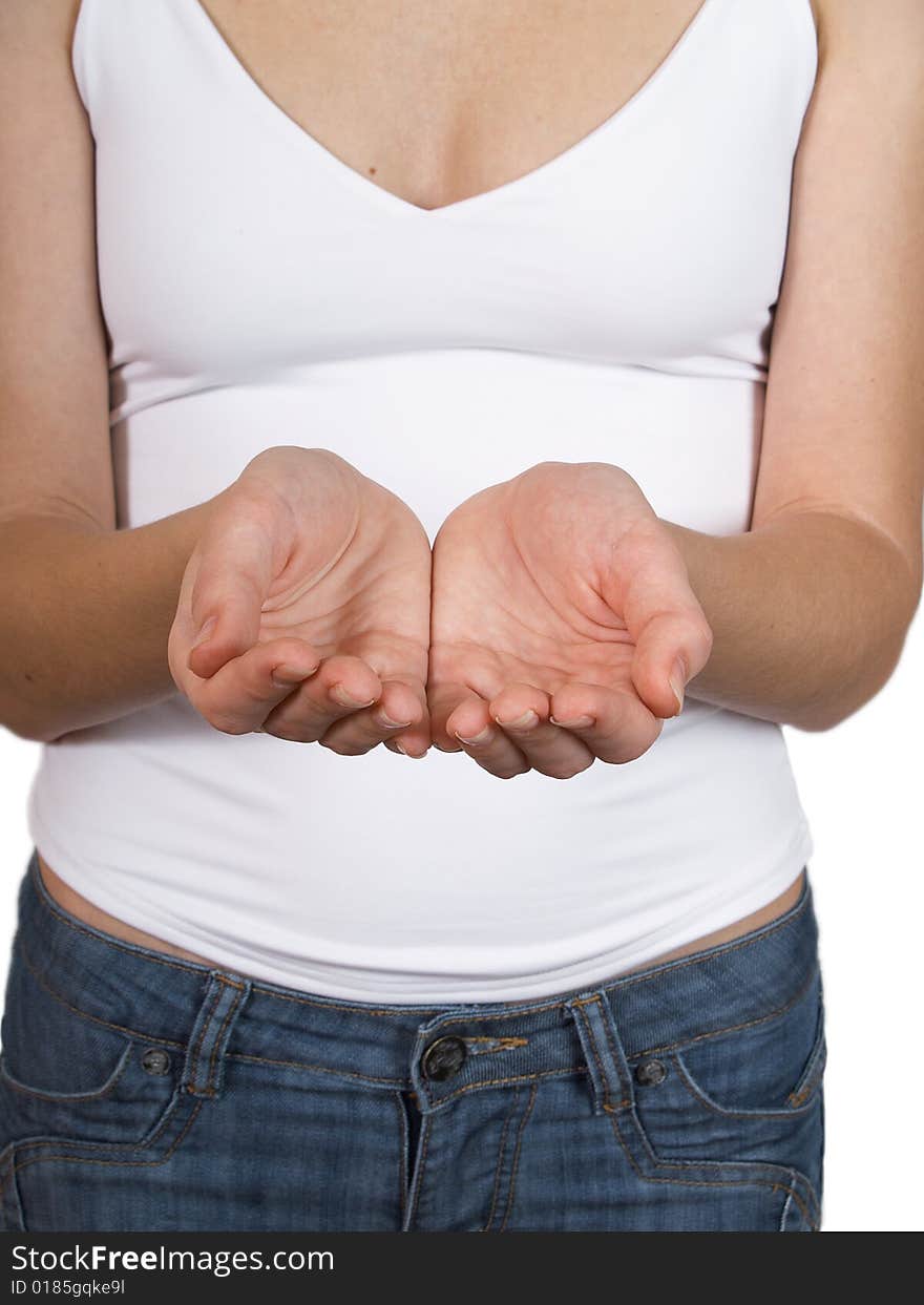 The girl in a white vest holds ahead of itself hands with open palms