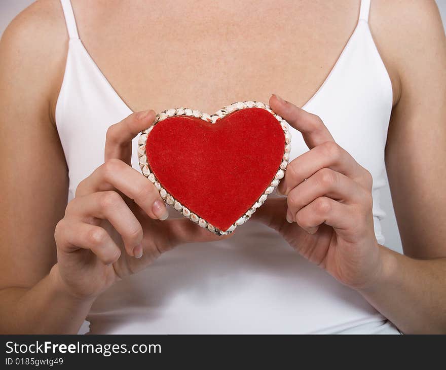 The girl in a white vest has control over red heart. The girl in a white vest has control over red heart