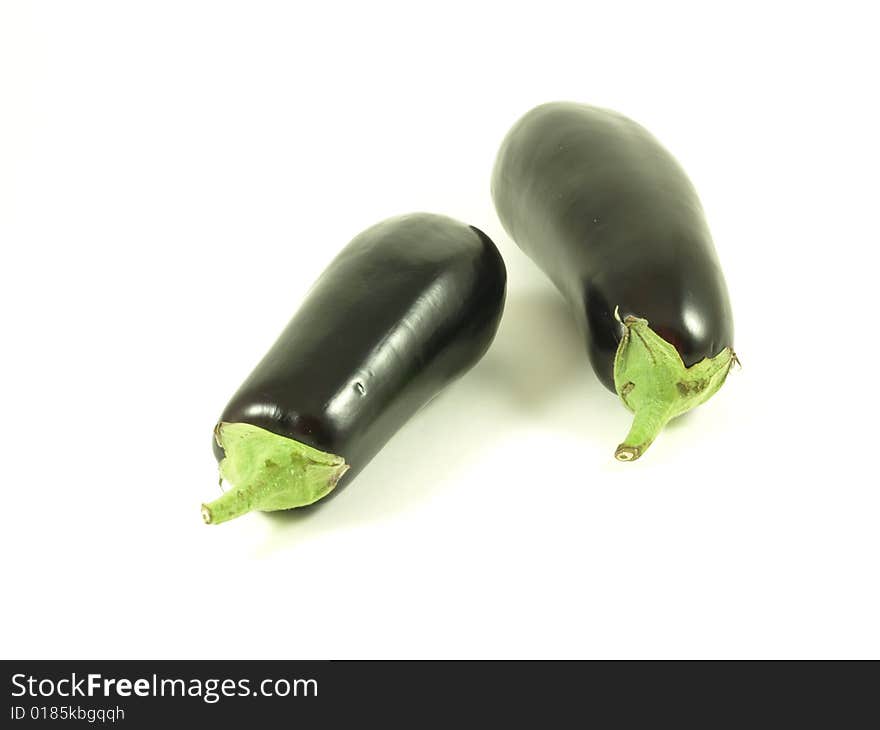 Two aubergines on isolated white background. Two aubergines on isolated white background.