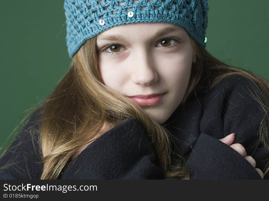 Teen girl in a hat and coat