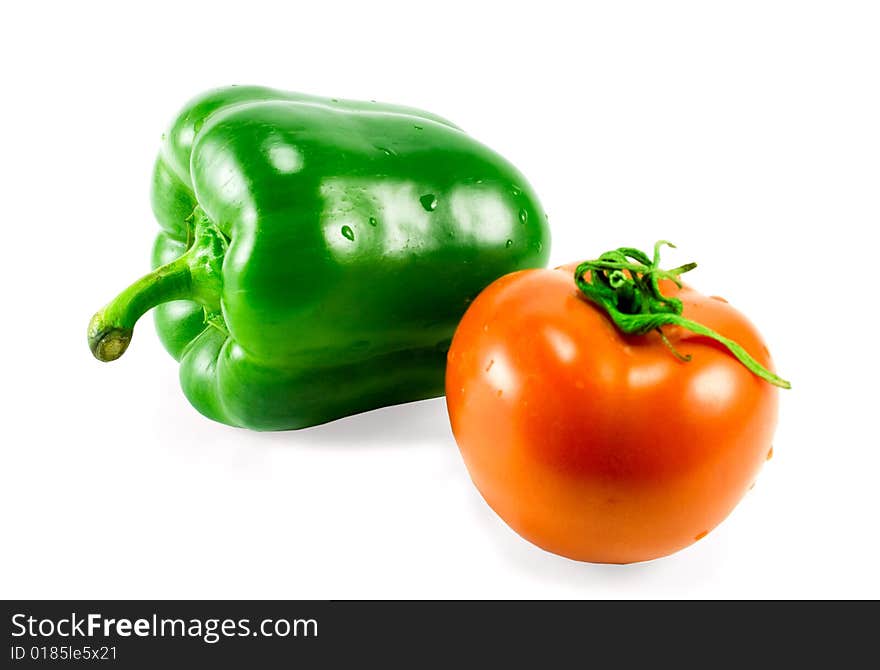 Bell pepper and tomato isolated on white background