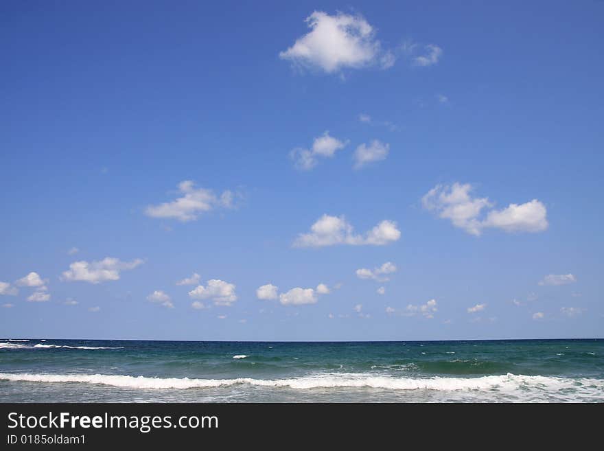 Black Sea, Bulgaria. Sea with waves and white clouds. Black Sea, Bulgaria. Sea with waves and white clouds.