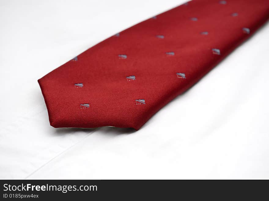 Macro of a necktie on a white shirt