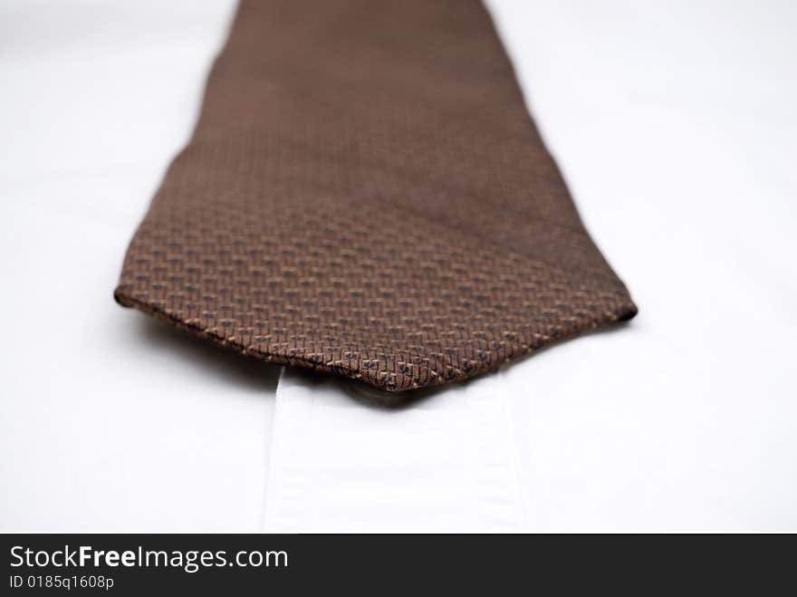 Shallow focus macro of a necktie on a white shirt