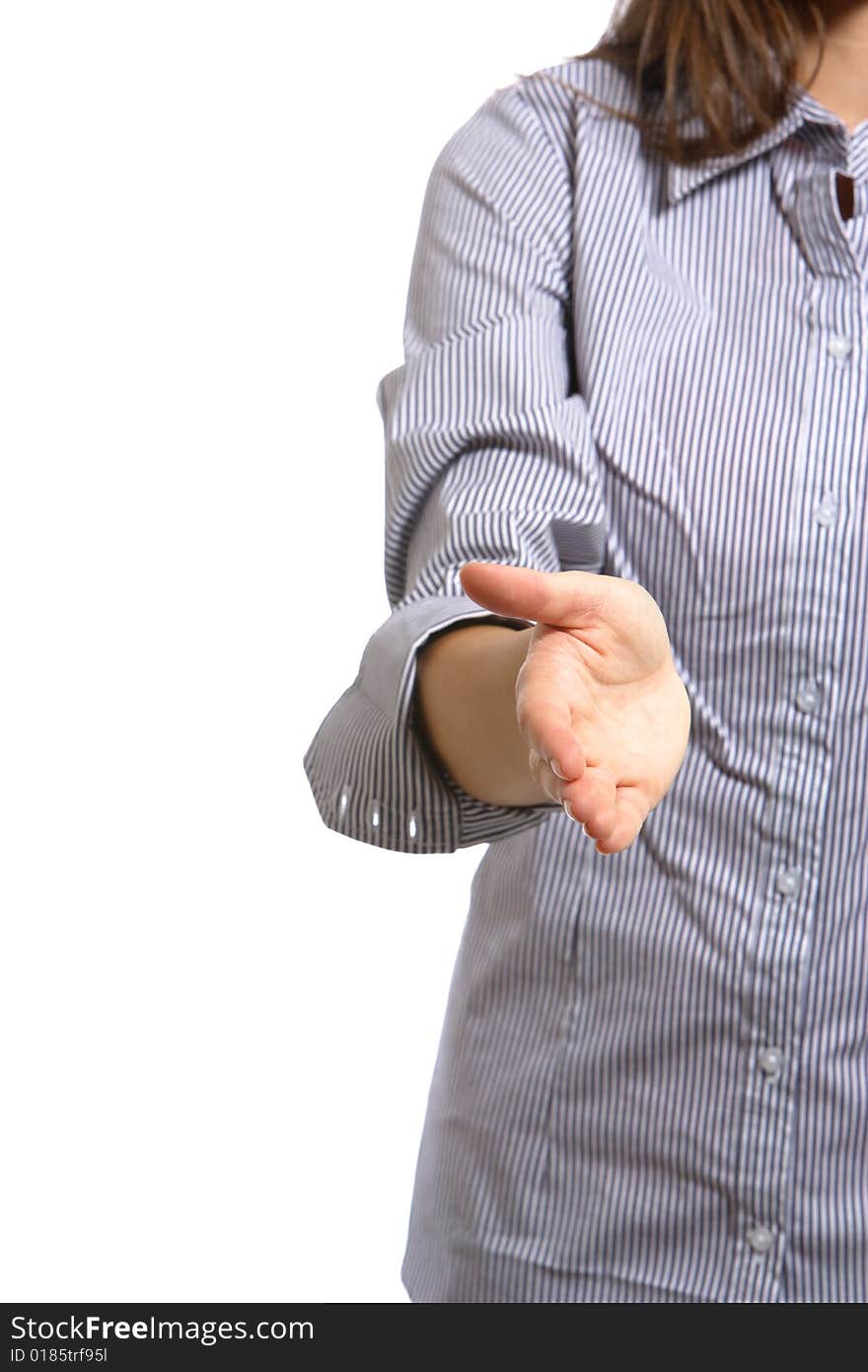 A business woman reaches for a handshake in front of the office building. A business woman reaches for a handshake in front of the office building