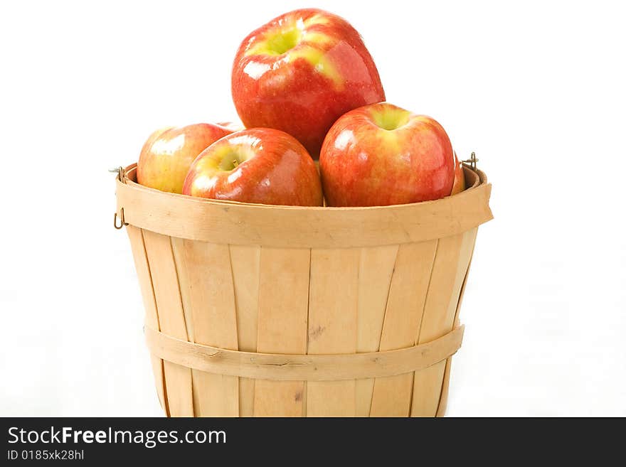 Crisp fall apples in a small wooden bushel. Crisp fall apples in a small wooden bushel.