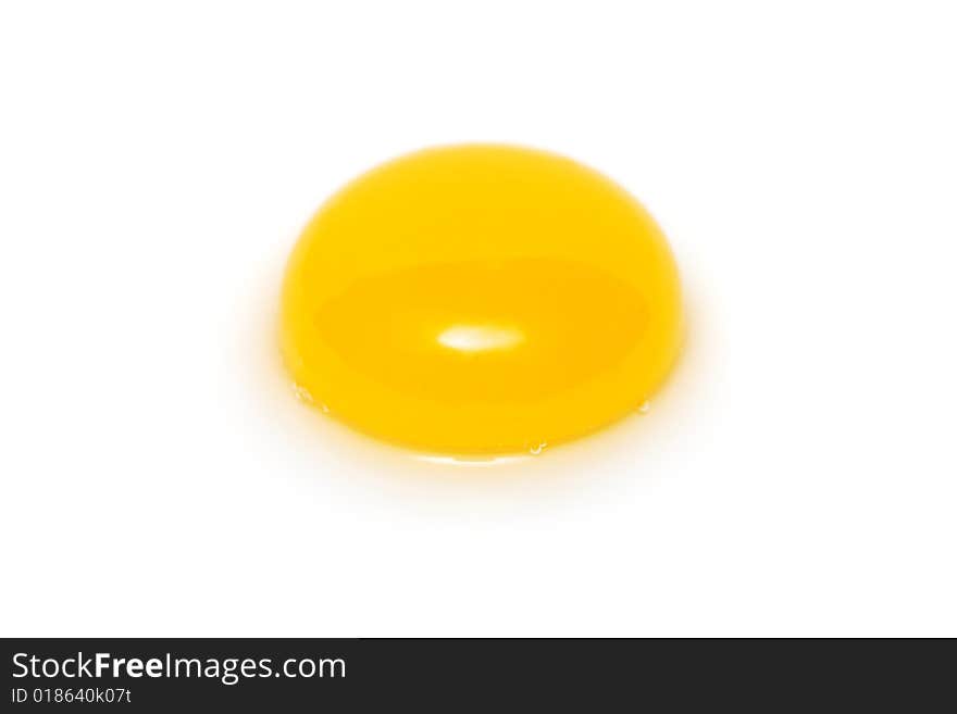 Close up of a yolk isolated on white background.