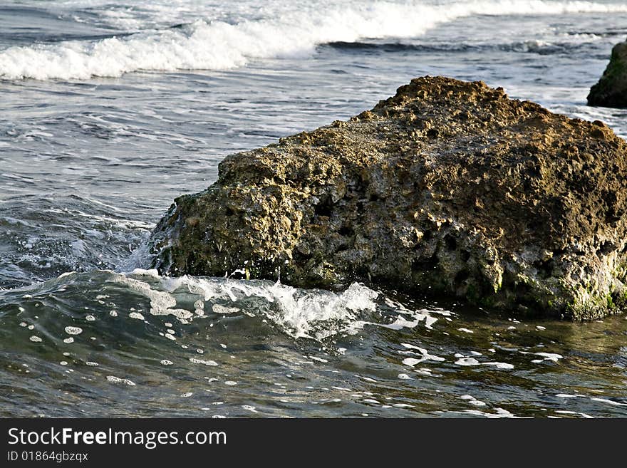 Waves broken about a stone