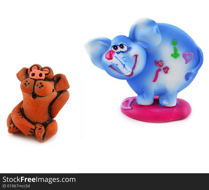 Toy clay dog and elephant isolated on a white background