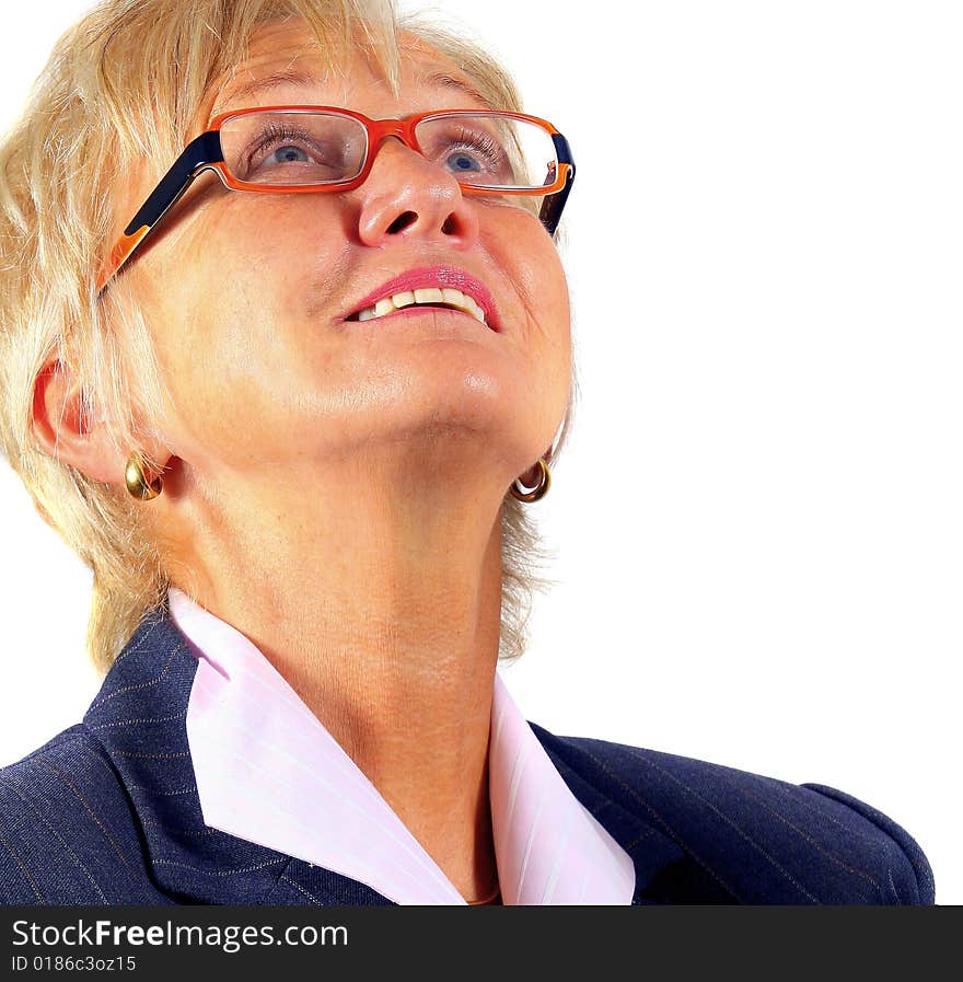 Business woman in her 50s looking up with glasses. Isolated over white. Business woman in her 50s looking up with glasses. Isolated over white.