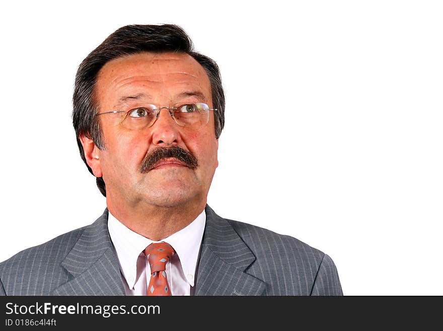 A businessman in his sixties with glasses a suit and a mustache. Isolated over white. A businessman in his sixties with glasses a suit and a mustache. Isolated over white.