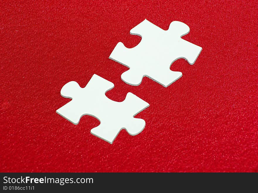 White puzzles isolated on a red