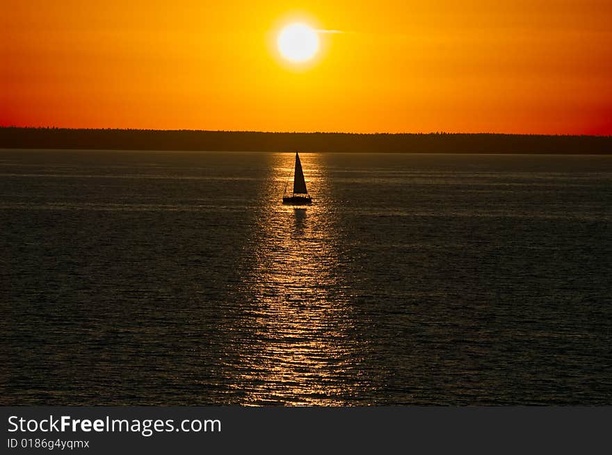 Sunset sailing boat