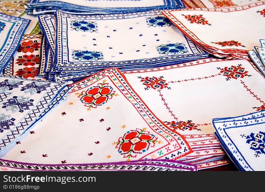 Many white fabrics with colorful embroidery