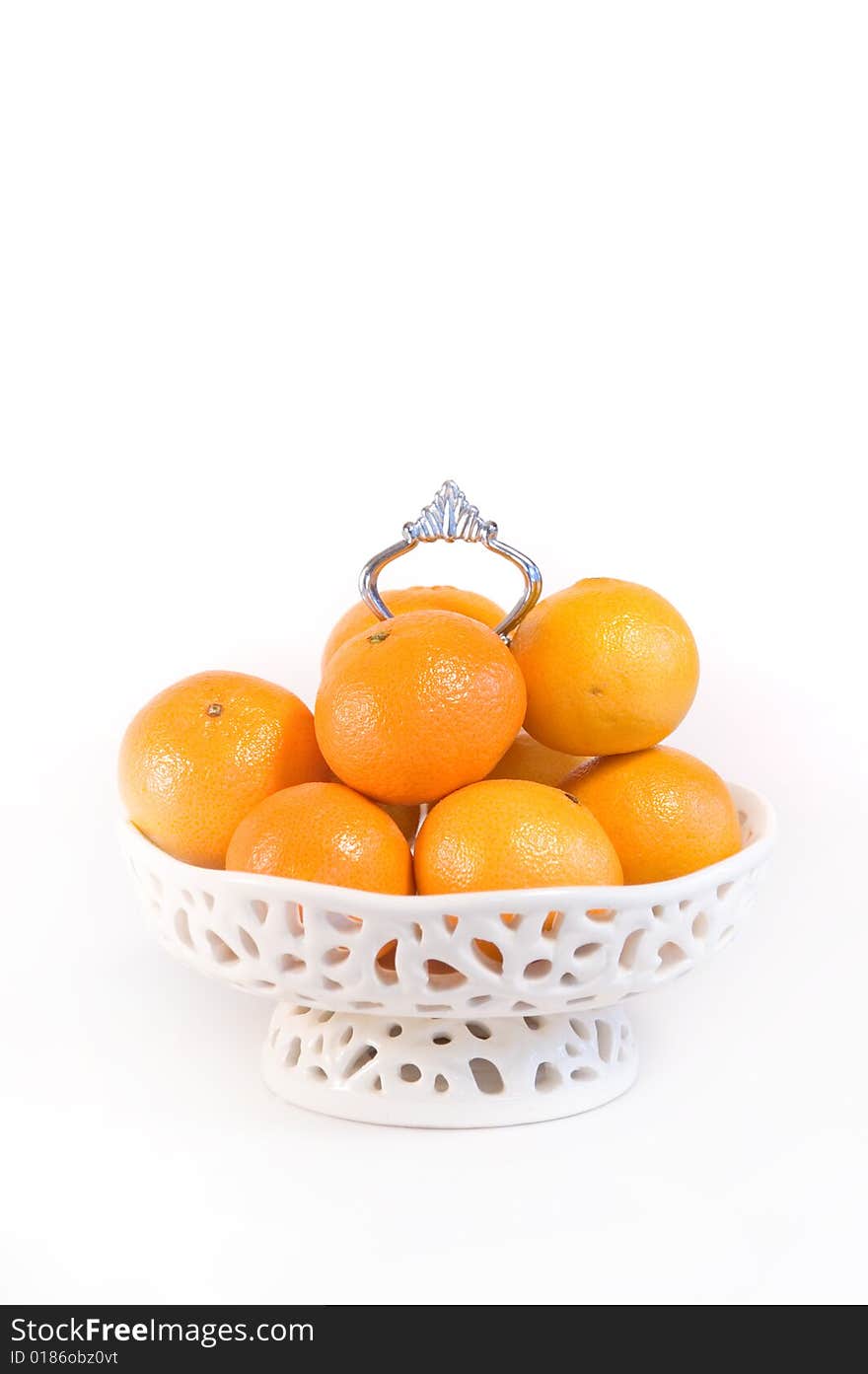 Luxe white Bowl filled with mandarin fruit. Luxe white Bowl filled with mandarin fruit