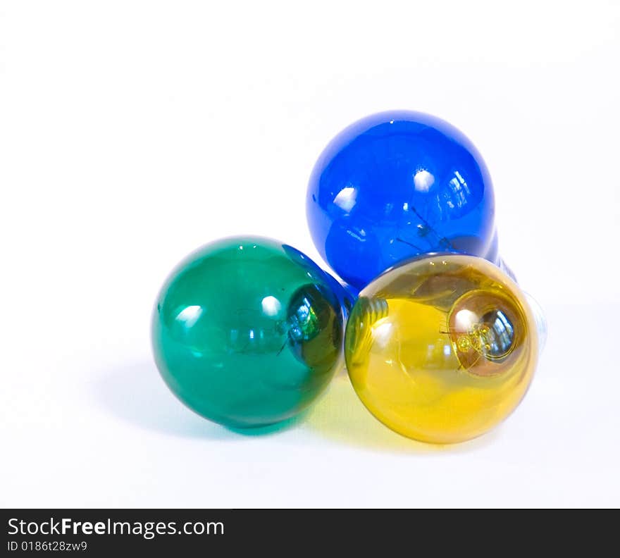 3 colored light bulbs in blue, yellow and green. 3 colored light bulbs in blue, yellow and green