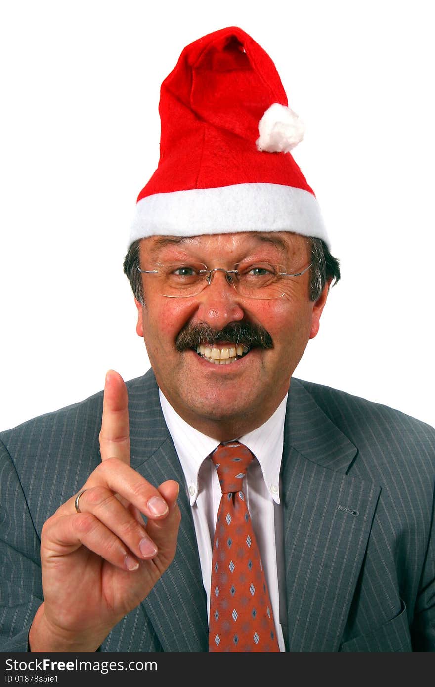 A senior businessman dressed up with a hat as Santa claus. Isolated over white. A senior businessman dressed up with a hat as Santa claus. Isolated over white.