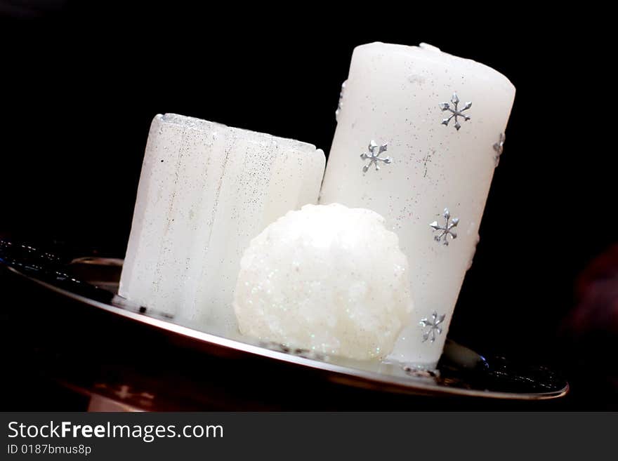 White christmas candles with silver snowflakes. White christmas candles with silver snowflakes