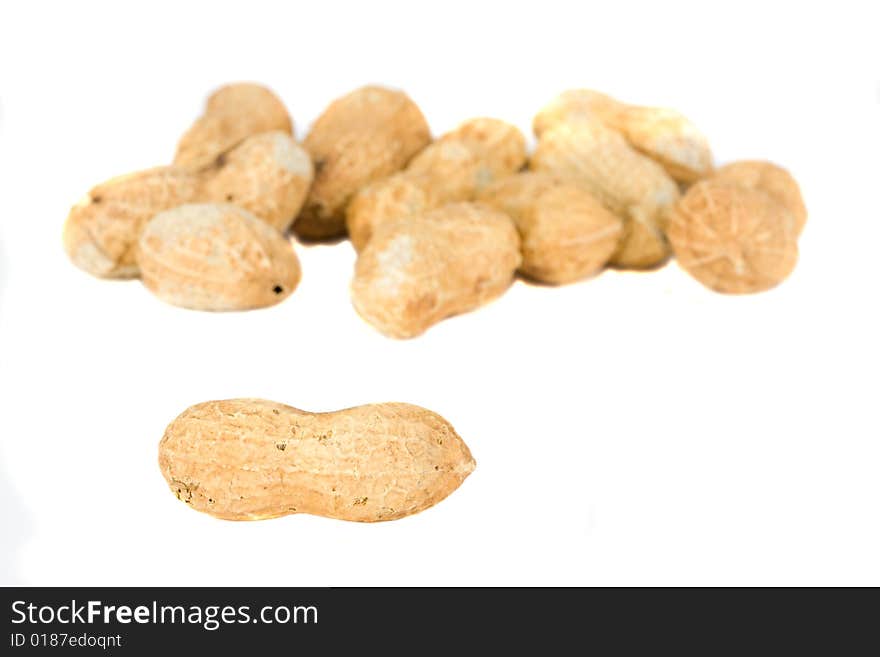 Some natural peanuts on white background