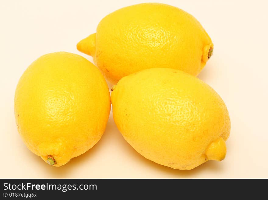 There are 3 yellow lemons. There are 3 yellow lemons