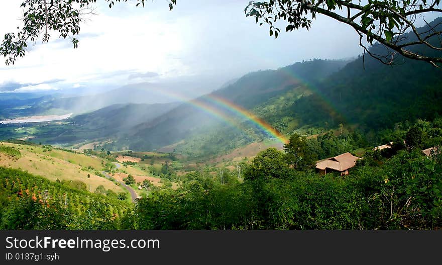 Rainbow with a hut on mountain