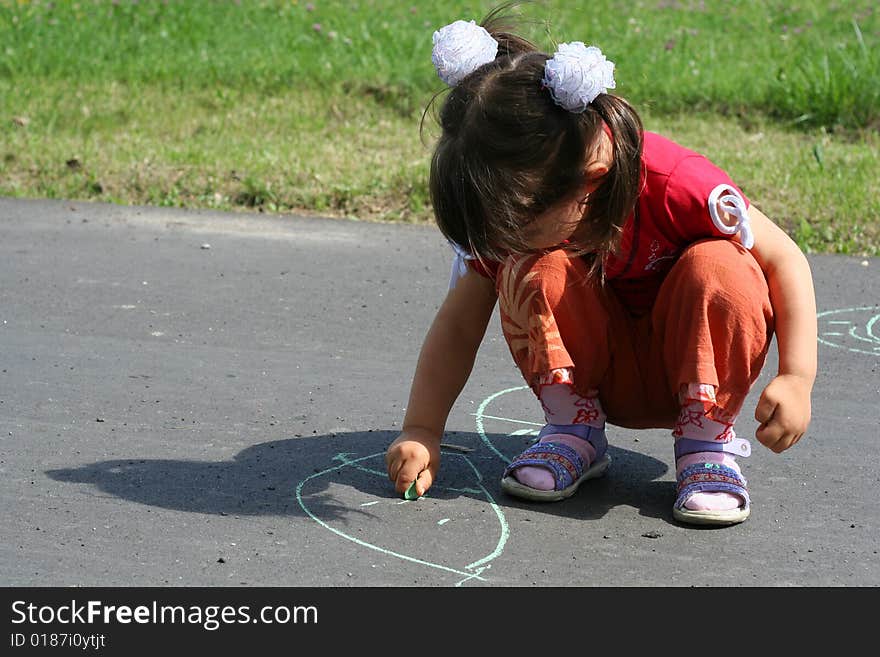 Little girl is drawing