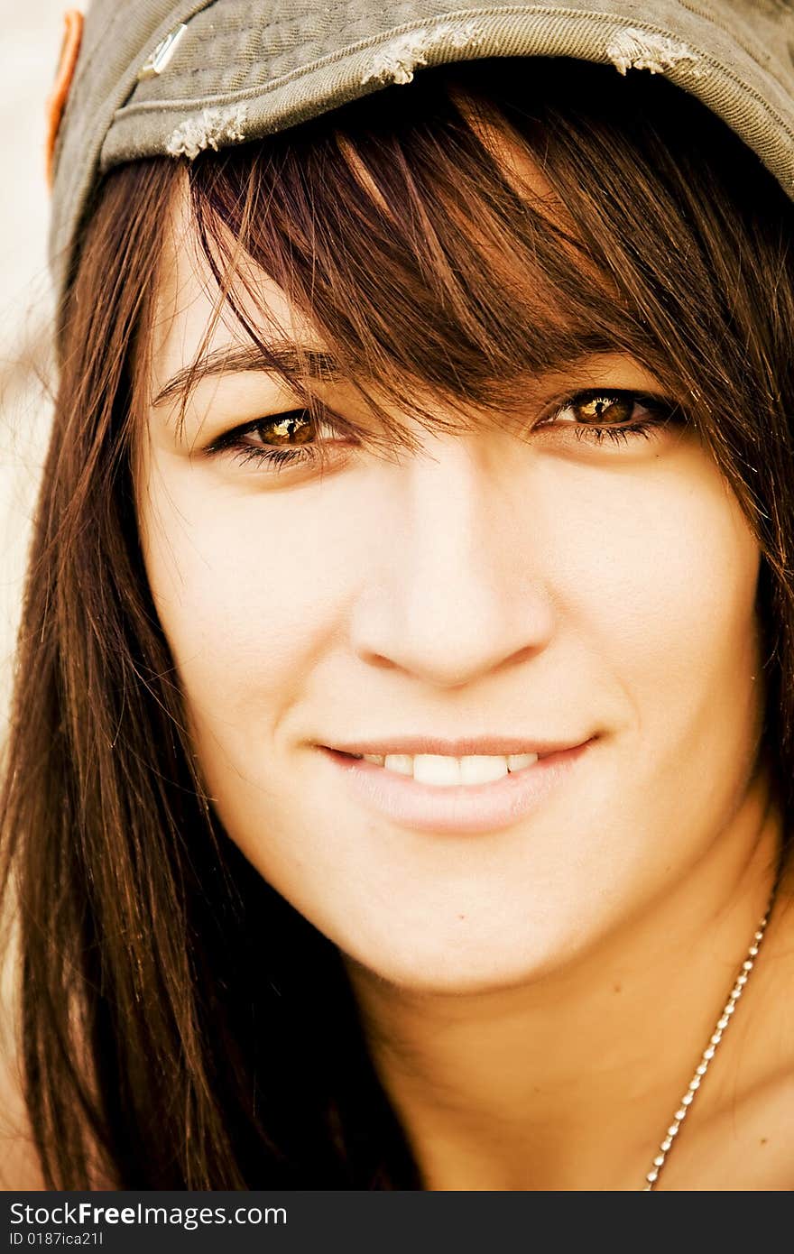 Young woman smiling at camera. Young woman smiling at camera.