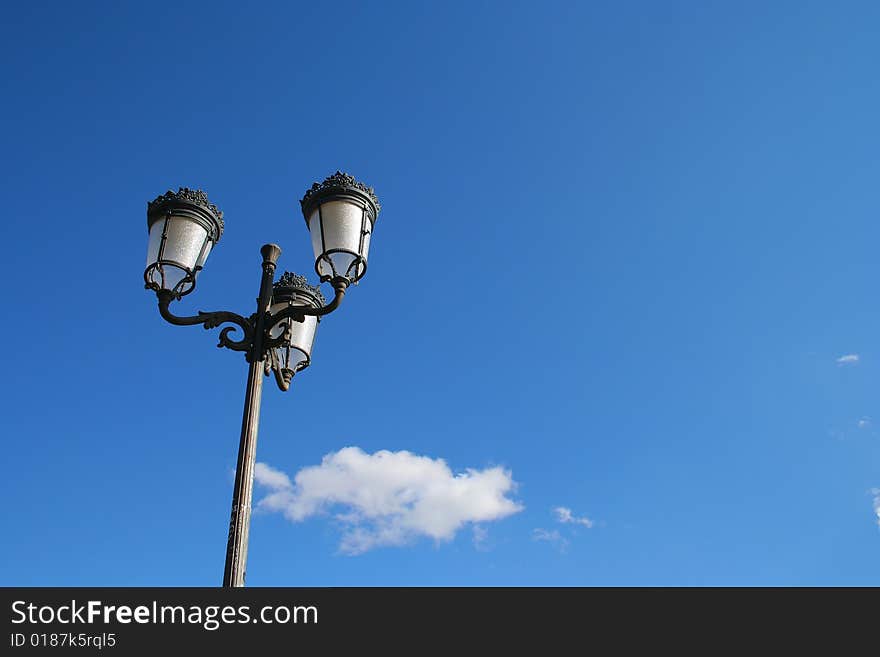 Street lamp on blue sky