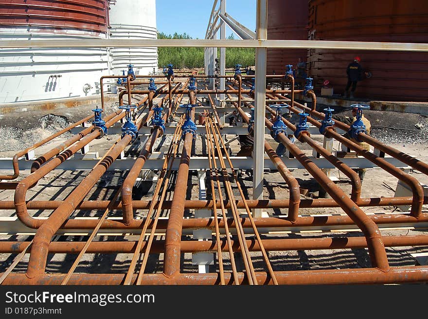 Metal pipes and valve at oil-factory