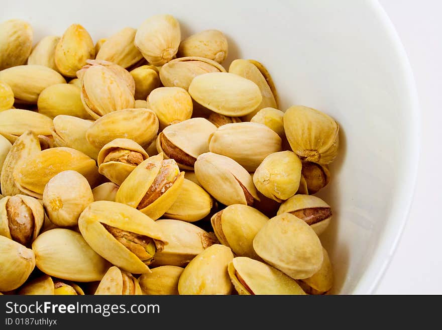 Bowl of tasty pistachios closeup. Bowl of tasty pistachios closeup