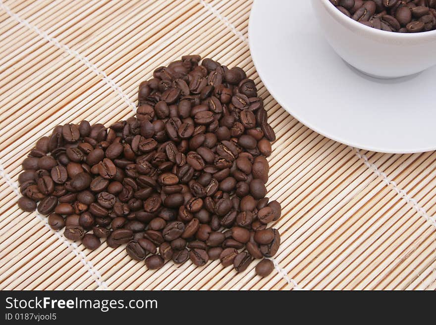 Heart of coffee beans with coffee cup. Heart of coffee beans with coffee cup.